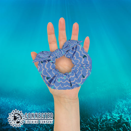 Hand Holding Shark Fin Scrunchie in Blue Color - Connected Clothing Company - Ethical & Sustainable Apparel - 10% donated to save the sharks