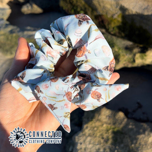 Hand Holding Sea Turtle Scrunchie - Connected Clothing Company - Ethical & Sustainable Apparel - 10% donated to save the sea turtles