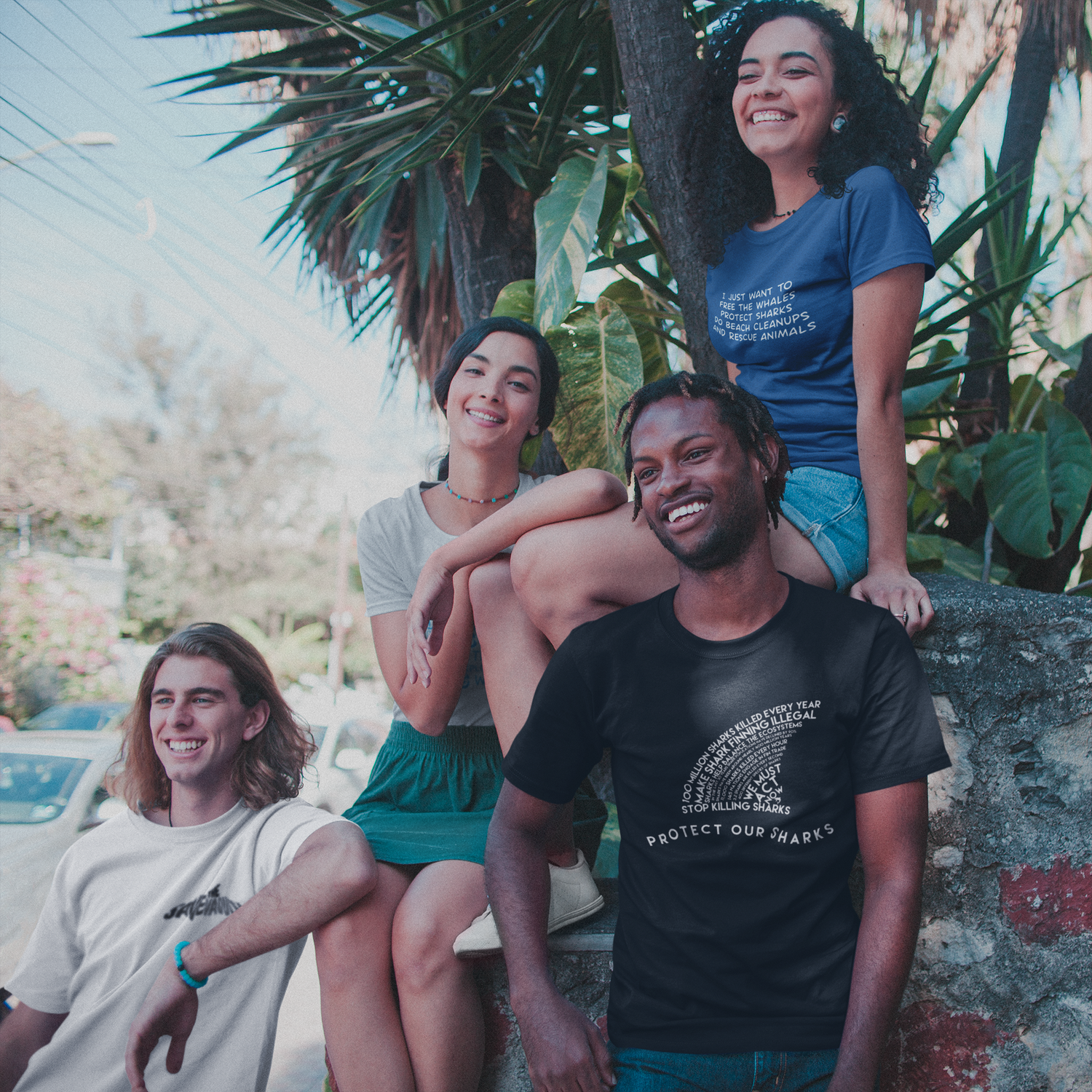 group of friends smiling while wearing Connected Clothing Company shirts - ethically and sustainably made products that give back to non-profit organizations