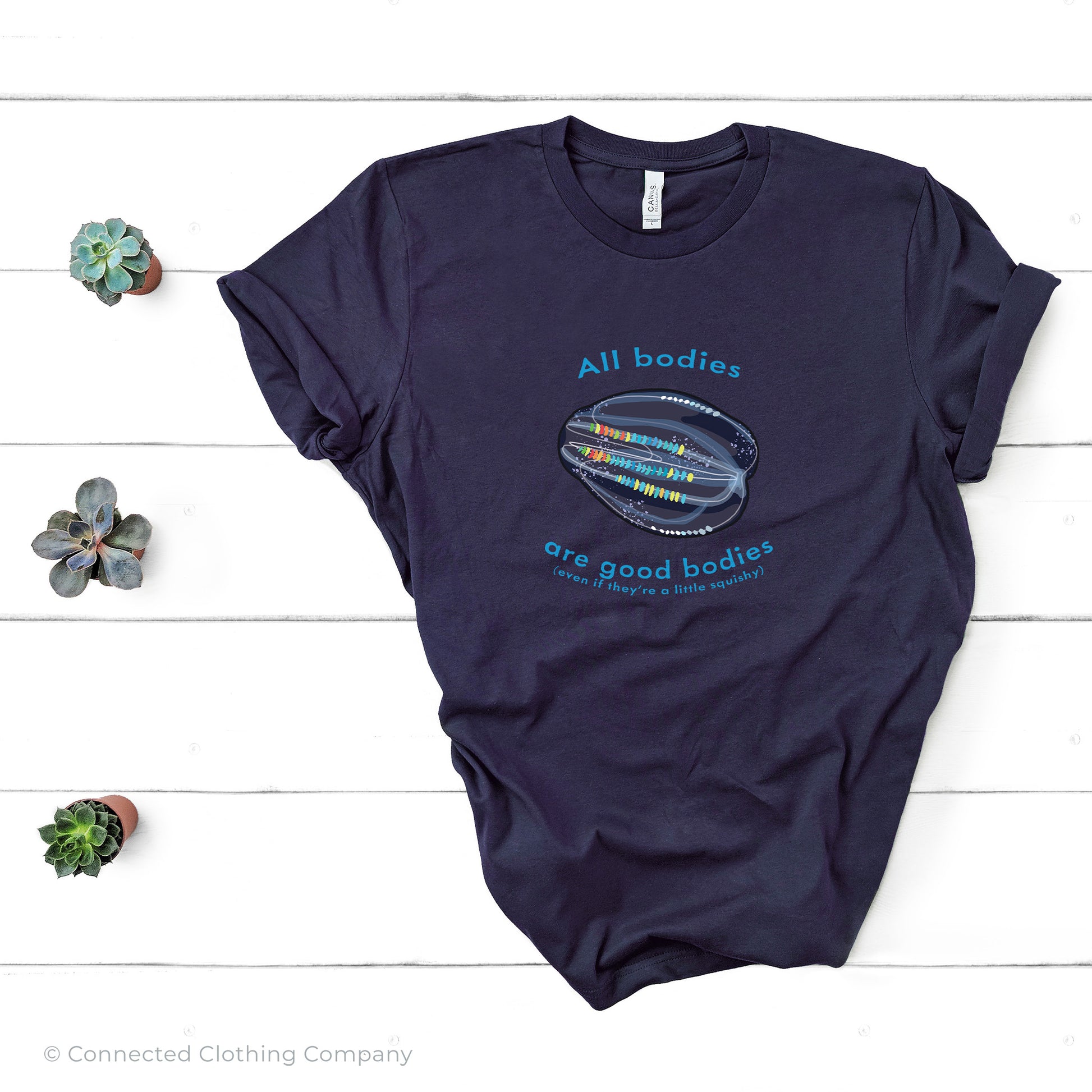 Navy All Bodies Are Good Bodies Tee reads "All bodies are good bodies (even if they're a little squishy)." and has a comb jelly ctenophore illustration - Connected Clothing Company - Ethically and Sustainably Made - 10% donated to Mission Blue ocean conservation