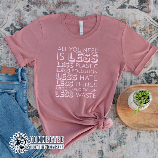 Mauve All You Need Is Less Short-Sleeve Unisex Tee reads "all you need is less. less plastic. less pollution. less hate. less things. less exploitation. less waste." - Connected Clothing Company - Ethically and Sustainably Made - 10% of profits donated to Mission Blue ocean conservation
