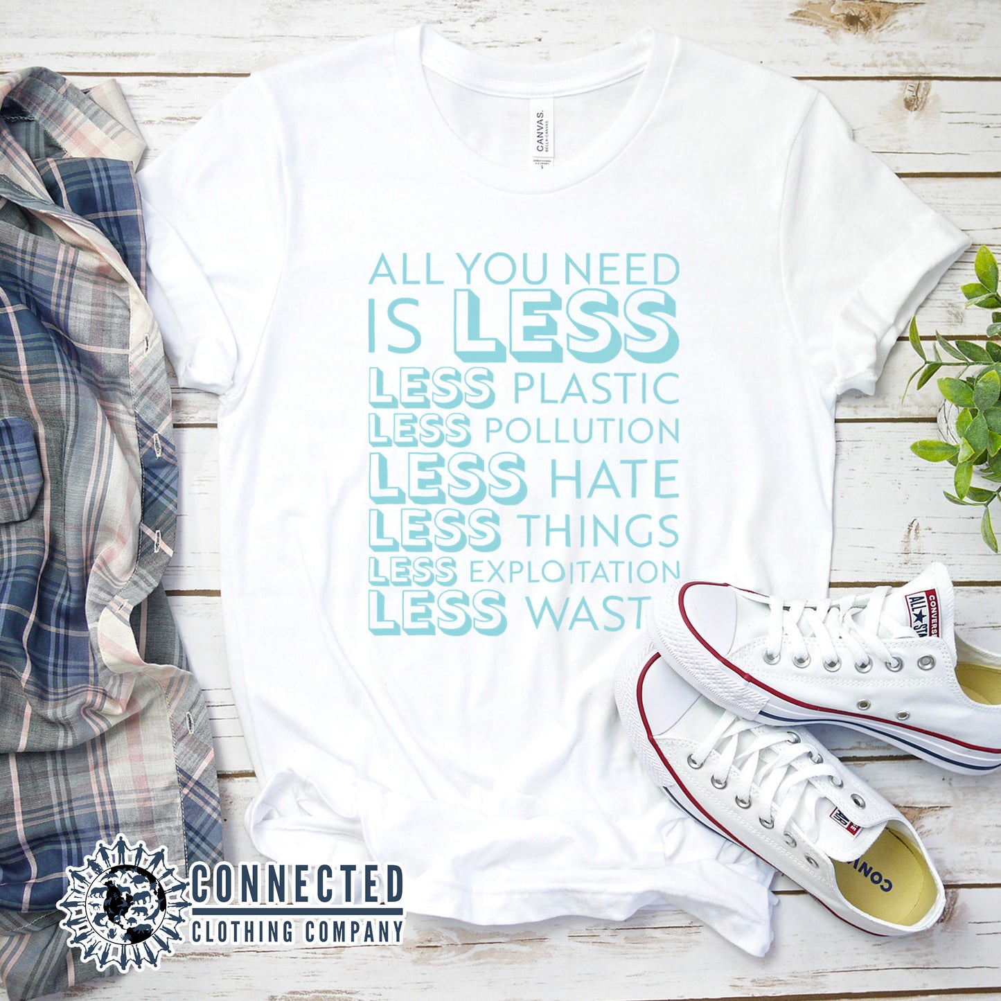 White All You Need Is Less Short-Sleeve Unisex Tee reads "all you need is less. less plastic. less pollution. less hate. less things. less exploitation. less waste." - Connected Clothing Company - Ethically and Sustainably Made - 10% of profits donated to Mission Blue ocean conservation