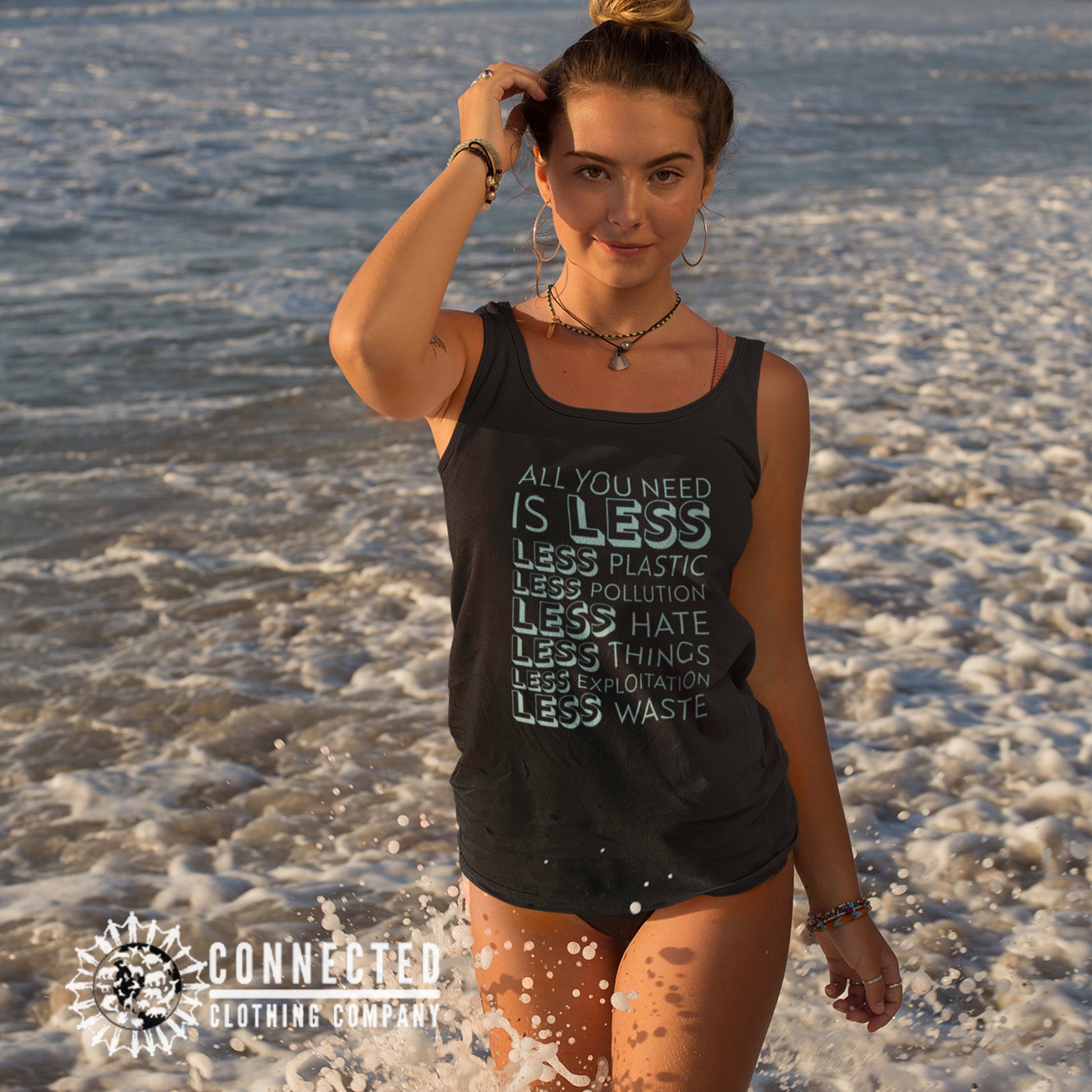 Model Wearing Black All You Need Is Less Women's Tank Top - Connected Clothing Company - 10% of profits donated to Mission Blue ocean conservation