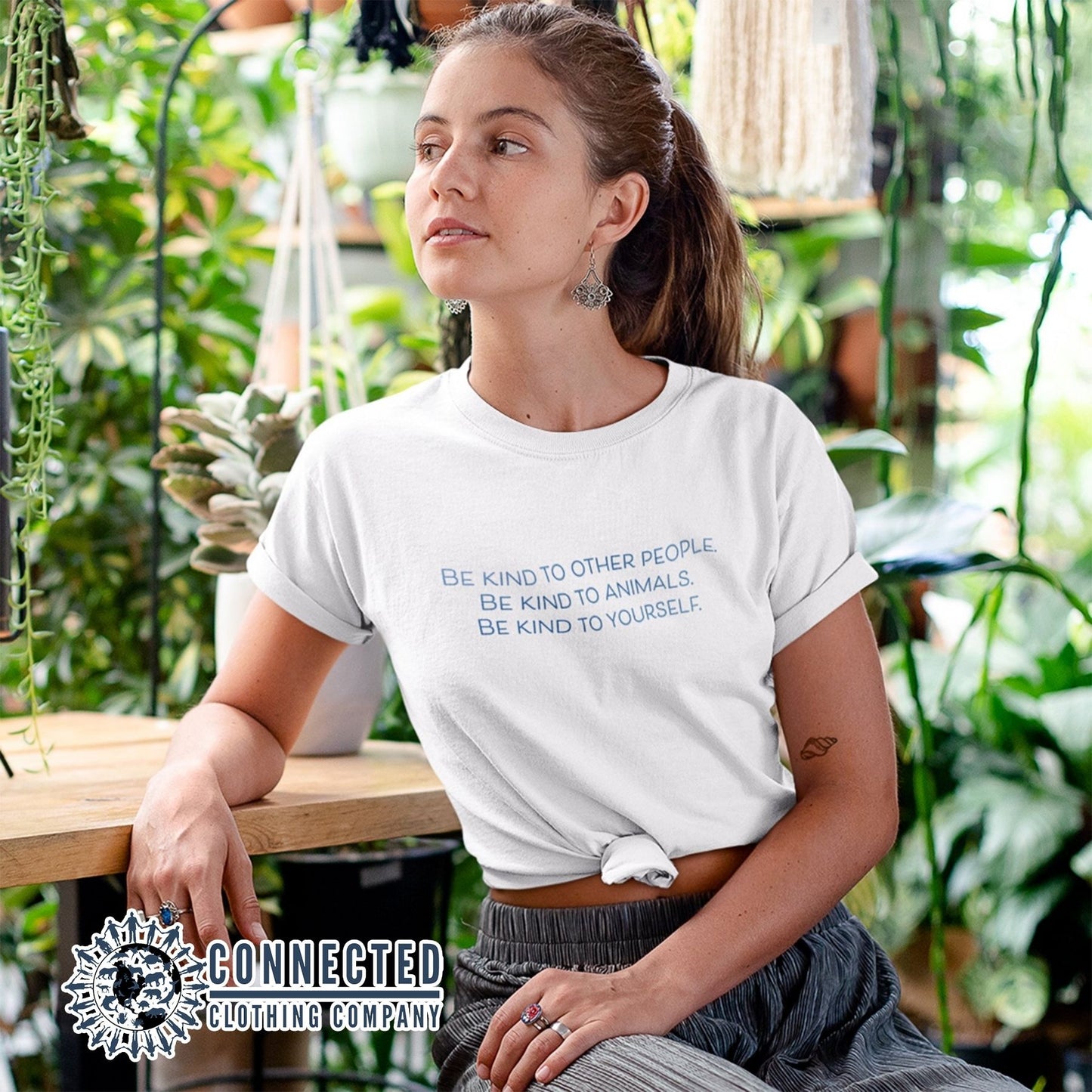 Model Wearing White Be Kind To All Short-Sleeve Tee - Connected Clothing Company - 10% of profits donated to ocean conservation