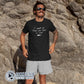 Model Wearing Black Be The Voice Shark Unisex Short-Sleeve T-Shirt reads "I speak for those who have no voice." - Connected Clothing Company - Ethically and Sustainably Made - 10% donated to Oceana shark conservation