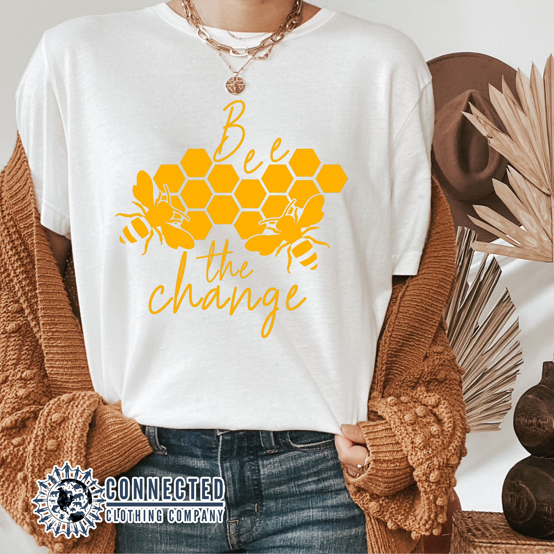 Model Wearing White Bee The Change Short-Sleeve Tee - Connected Clothing Company - 10% of profits donated to the Honeybee Conservancy