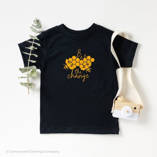 Bee The Change Toddler Short-Sleeve Tee in Black - Connected Clothing Company - 10% of profits donated to The Honeybee Conservancy, supporting bee conservation and building bee habitats