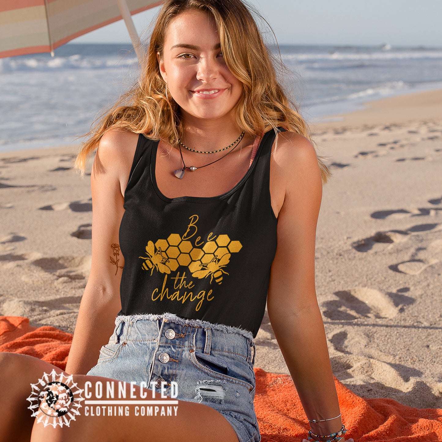 Model Wearing Black Bee The Change Women's Tank - Connected Clothing Company - 10% of profits donated to the Honeybee Conservancy
