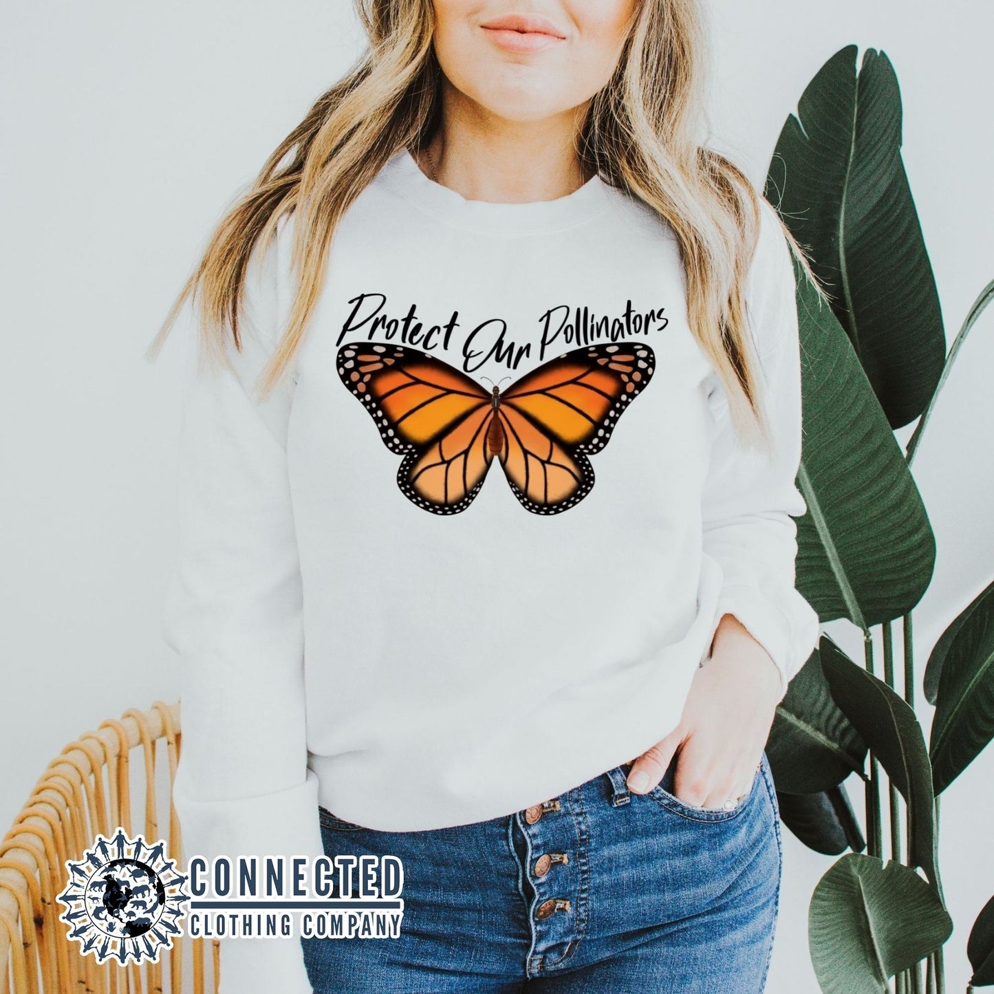 Model Wearing White Protect Our Pollinators Crewneck Sweatshirt - Connected Clothing Company - Ethically and Sustainably Made - 10% of profits donated to pollinator and monarch conservation and ocean conservation