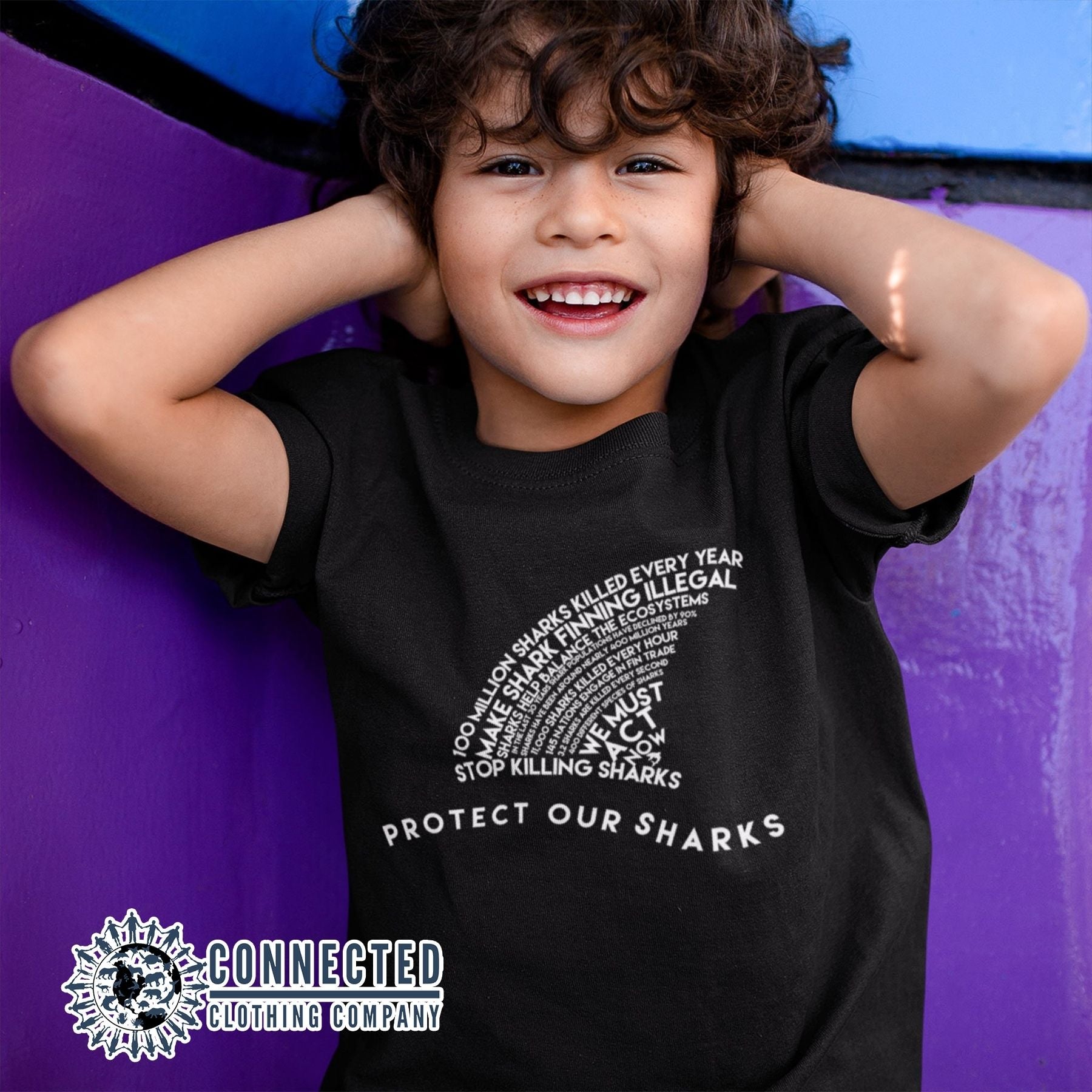 Kid Wearing Black Protect Our Sharks Youth Short-Sleeve Tee - Connected Clothing Company - 10% of profits donated to Oceana ocean conservation