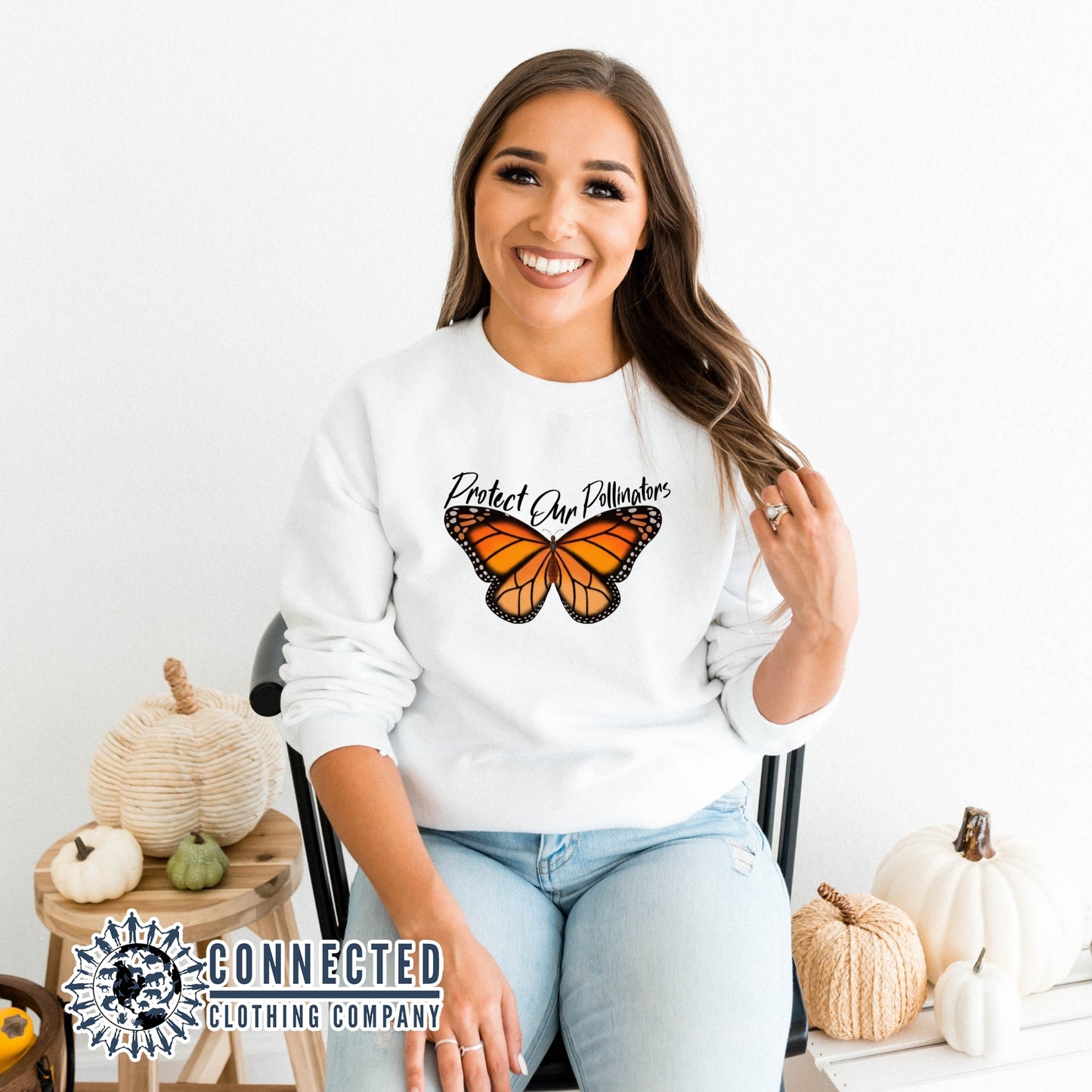 Model Wearing White Protect Our Pollinators Crewneck Sweatshirt - Connected Clothing Company - Ethically and Sustainably Made - 10% of profits donated to pollinator and monarch conservation and ocean conservation