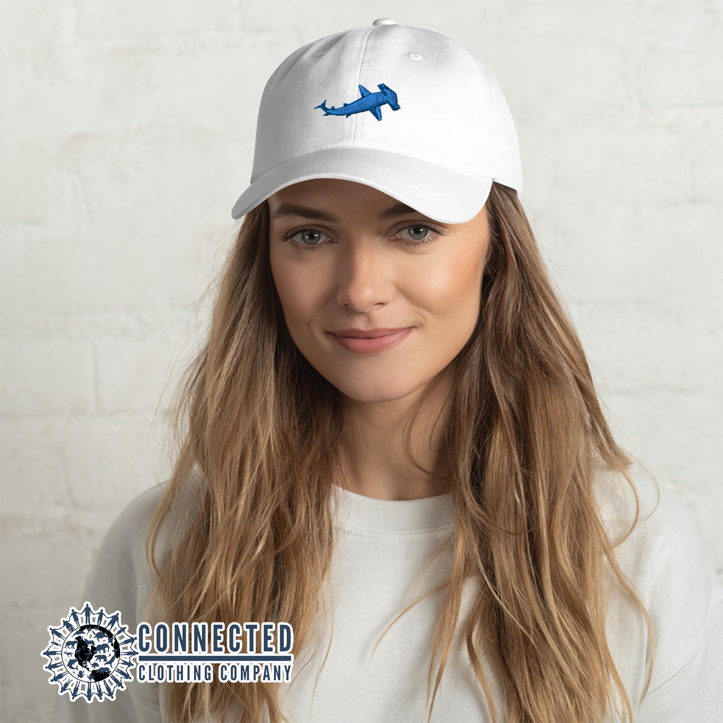 Model Wearing White Hammerhead Shark Cotton Cap - Connected Clothing Company - Ethical & Sustainable Clothing That Gives Back - 10% donated to Oceana shark conservation