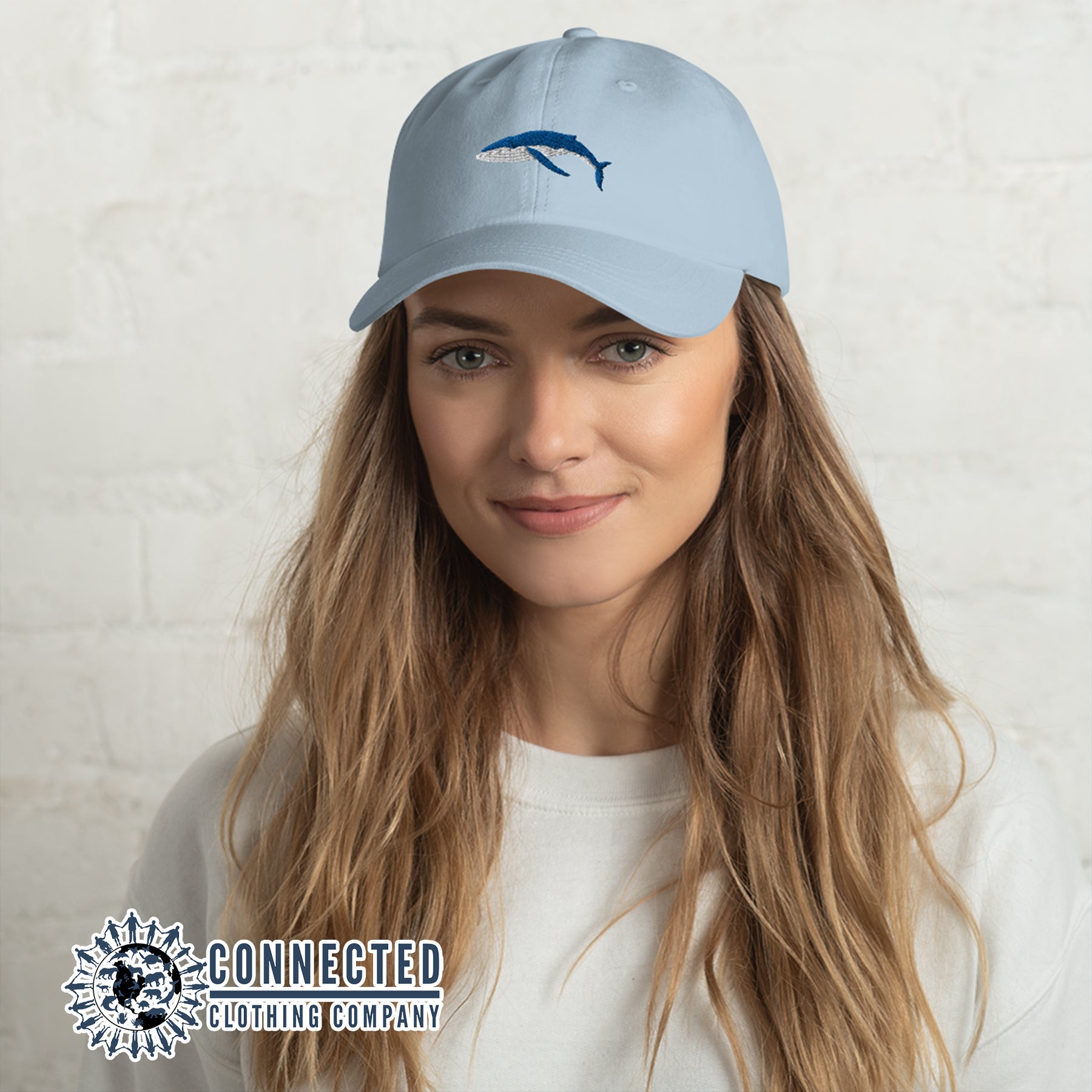 Model Wearing Blue Humpback Whale Cotton Cap - Connected Clothing Company - 10% of profits donated to Mission Blue ocean conservation