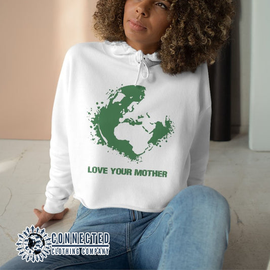 Model Wearing White Love Your Mother Earth Crop Hoodie - Connected Clothing Company - Ethically and Sustainably Made - 10% donated to the Environmental Defense Fund