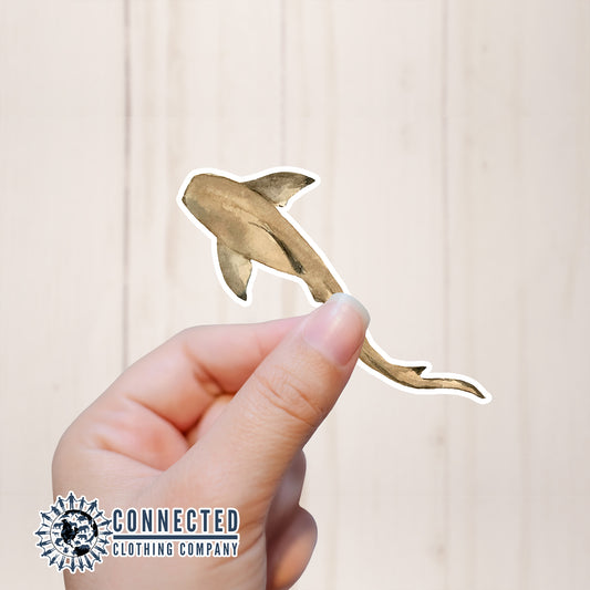 Hand Holding Nurse Shark Watercolor Sticker - Connected Clothing Company - Ethical and Sustainable Apparel - portion of profits donated to shark conservation