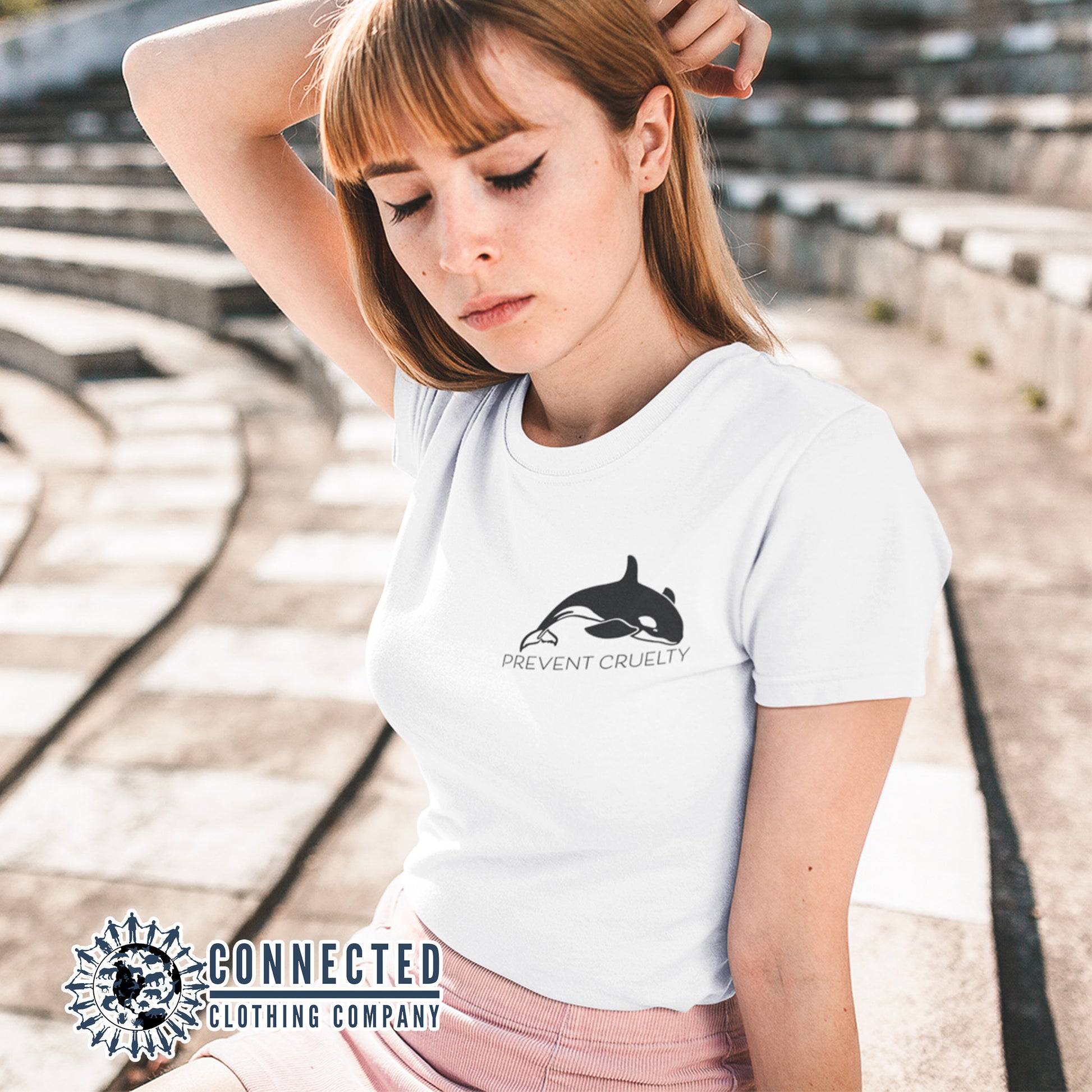 Model Wearing White Prevent Cruelty Orca Short-Sleeve Tee - Connected Clothing Company - Ethically and Sustainably Made - 10% donated to Humane Society International animal cruelty prevention