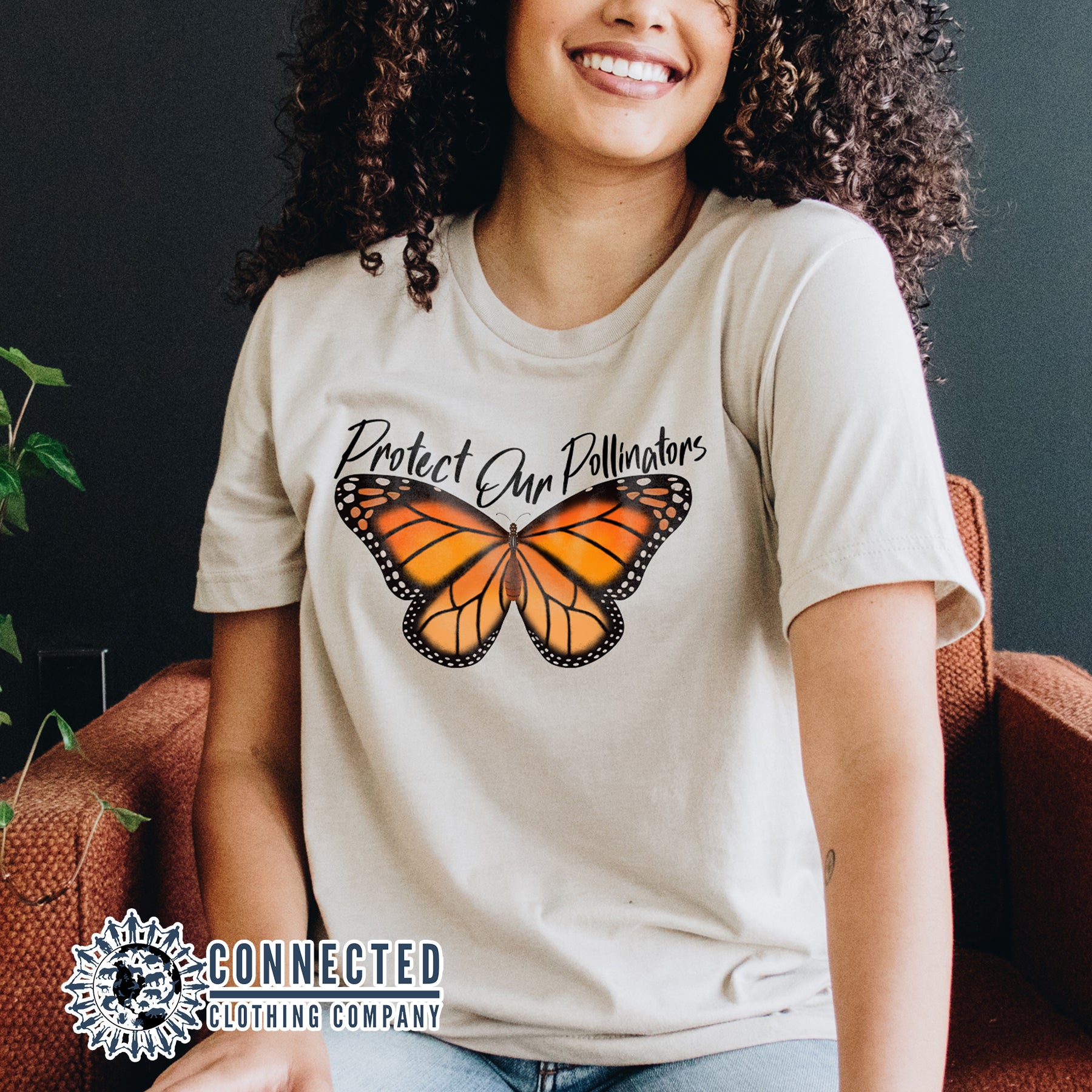 Model Wearing Soft Cream Protect Our Pollinators Short-Sleeve Tee - Connected Clothing Company - Ethically and Sustainably Made - 10% of profits donated to pollinator and monarch conservation and ocean conservation