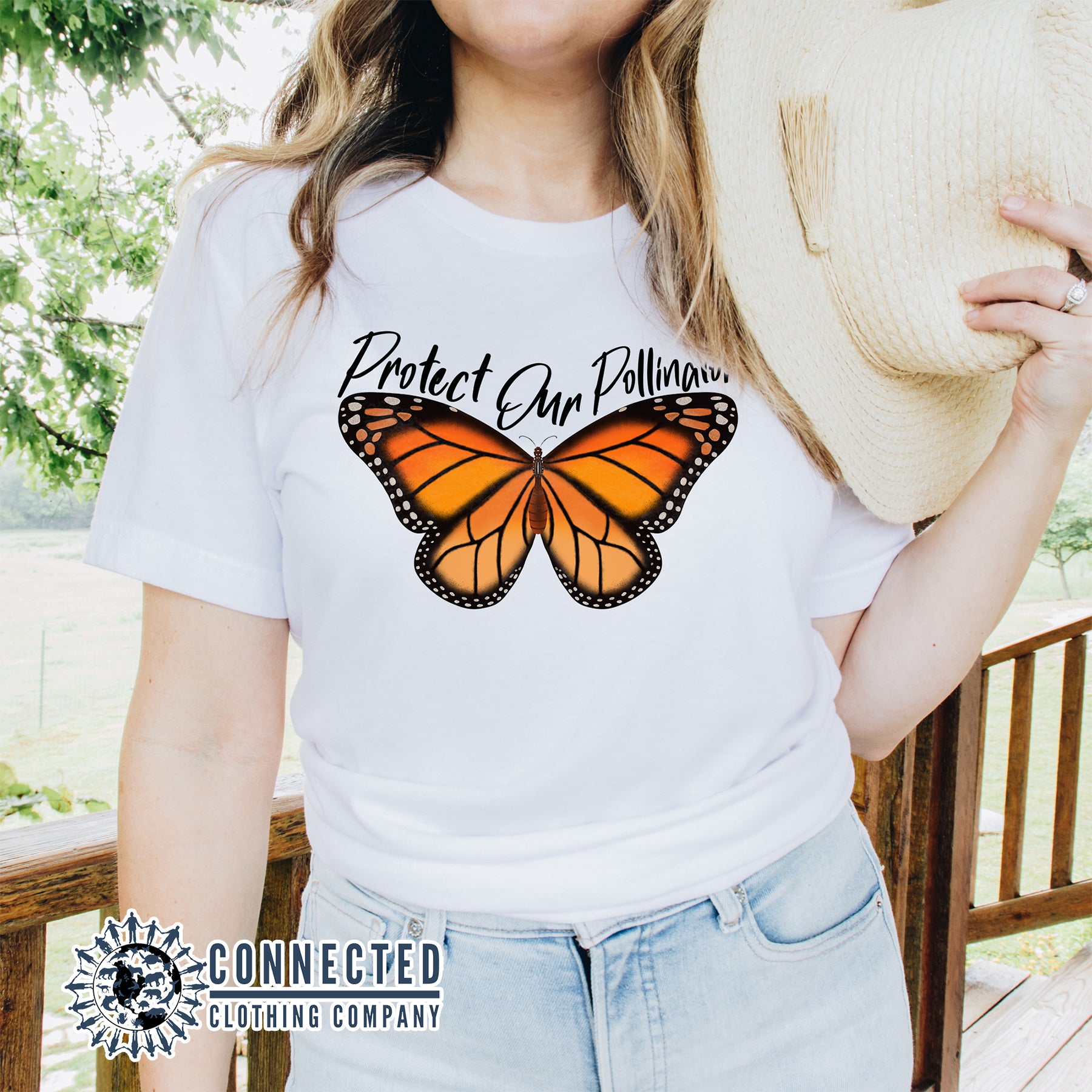 Model Wearing White Protect Our Pollinators Short-Sleeve Tee - Connected Clothing Company - Ethically and Sustainably Made - 10% of profits donated to pollinator and monarch conservation and ocean conservation