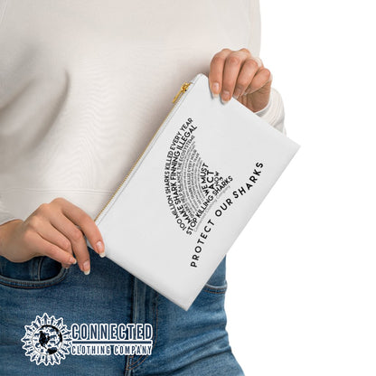 Model holding White Protect Our Sharks Cosmetic Bag - Connected Clothing Company - Ethically and Sustainably Made - 10% of profits donated to shark conservation and ocean conservation