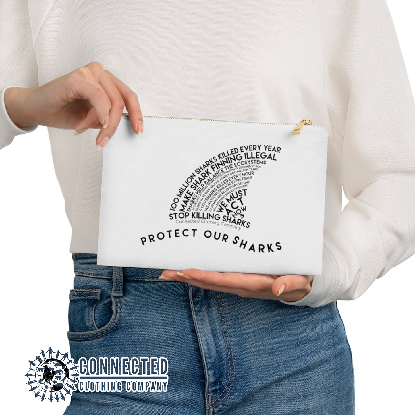 Model holding White Protect Our Sharks Cosmetic Bag - Connected Clothing Company - Ethically and Sustainably Made - 10% of profits donated to shark conservation and ocean conservation