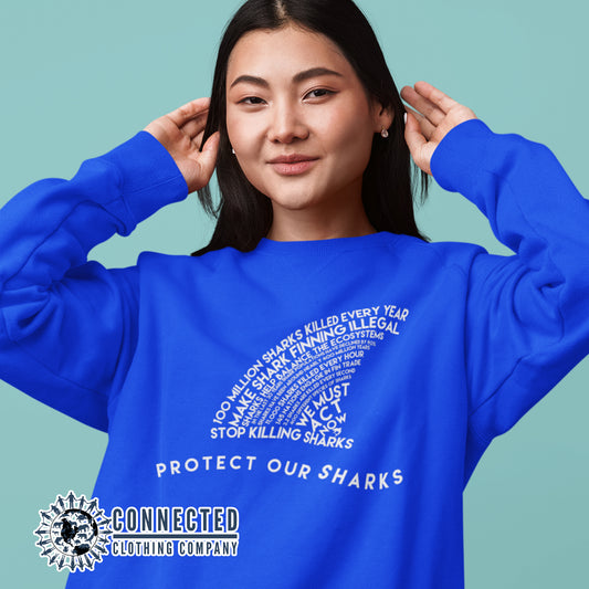 Model Wearing Royal Blue Protect Our Sharks Unisex Crewneck Sweatshirt - Connected Clothing Company - Ethically and Sustainably Made - 10% of profits donated to shark conservation and ocean conservation