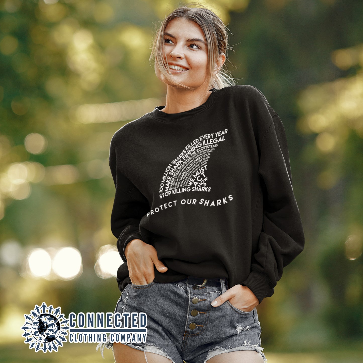 Model Wearing Black Protect Our Sharks Unisex Crewneck Sweatshirt - Connected Clothing Company - Ethically and Sustainably Made - 10% of profits donated to shark conservation and ocean conservation