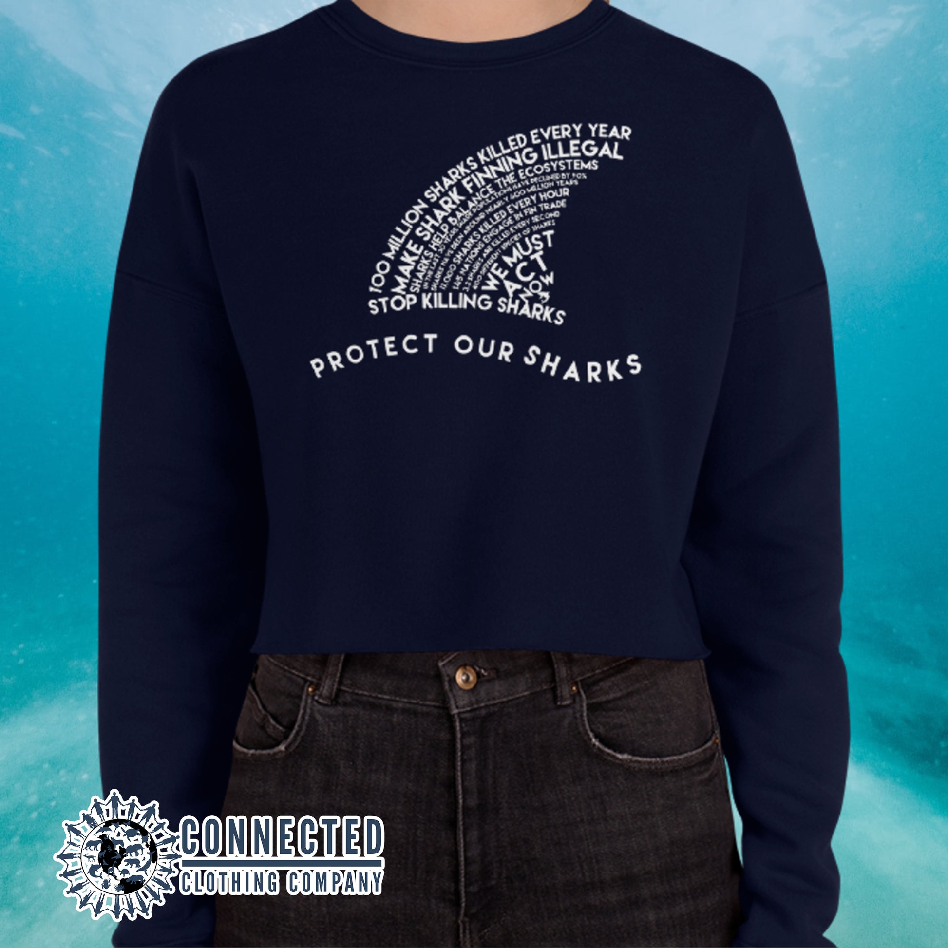 Model Wearing Navy Protect Our Sharks Crop Sweatshirt - Connected Clothing Company - Ethically and Sustainably Made - 10% of profits donated to shark conservation and ocean conservation