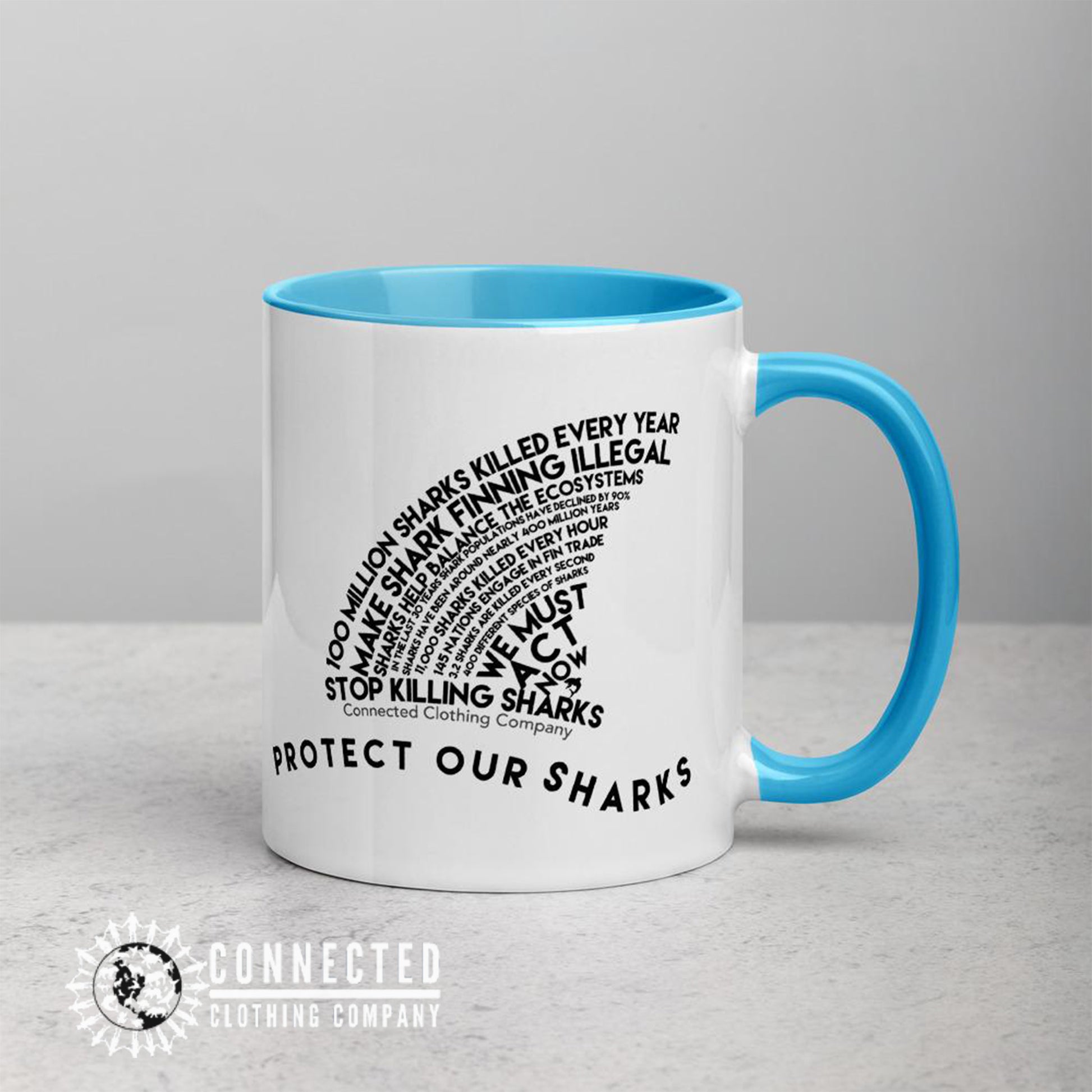 Left Side of Protect Our Sharks Mug With Blue Coloring on Inside, Rim, and Handle - Connected Clothing Company - Ethically and Sustainably Made - 10% donated to Oceana shark conservation