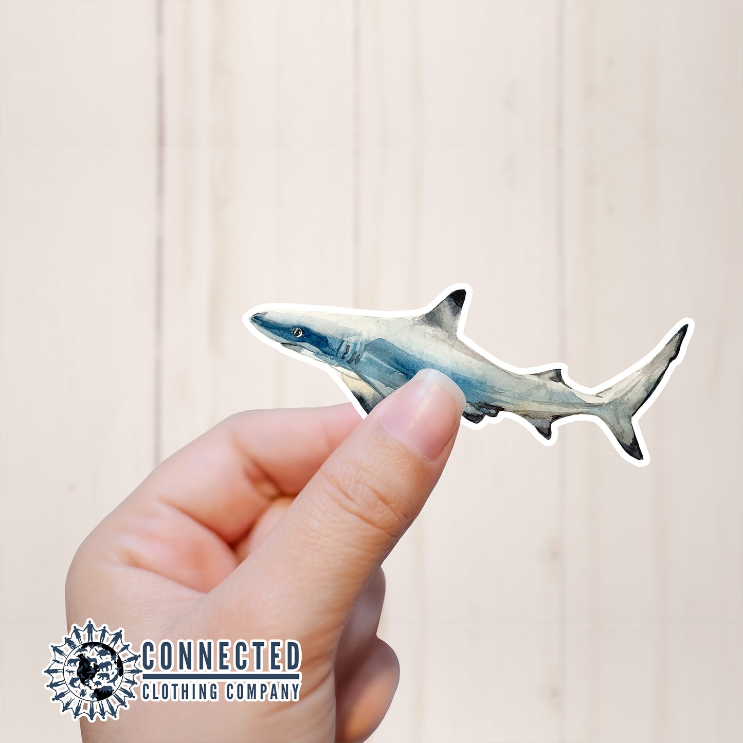 Hand Holding Reef Shark Watercolor Sticker - Connected Clothing Company - Ethical and Sustainable Apparel - portion of profits donated to shark conservation