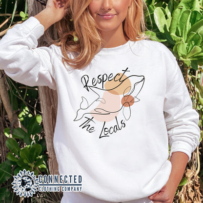 Model Wearing White Respect The Locals Orca Unisex Crewneck Sweatshirt - Connected Clothing Company - Ethically and Sustainably Made - 10% of profits donated to ocean conservation