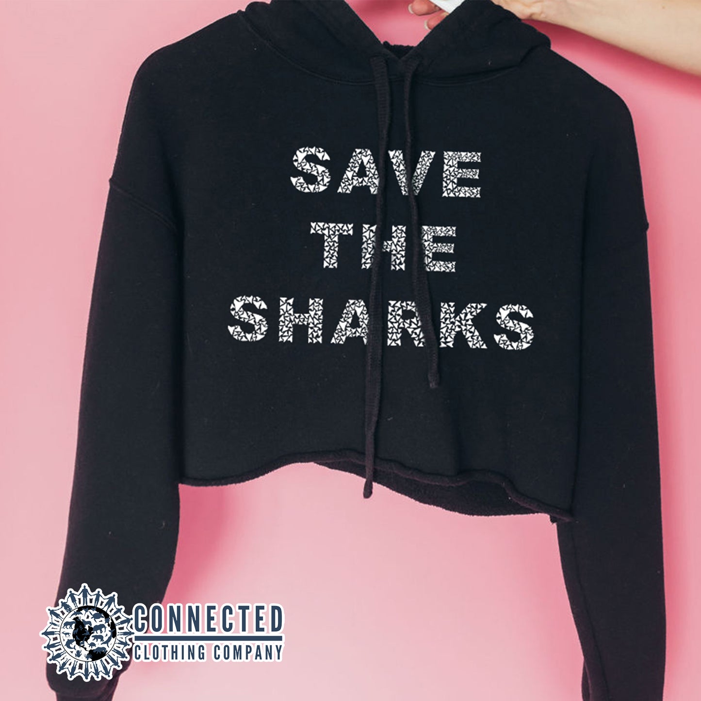 Hand Holding Black Save The Sharks Crop Hoodie - Connected Clothing Company - Ethically and Sustainably Made - 10% donated to Oceana shark conservation