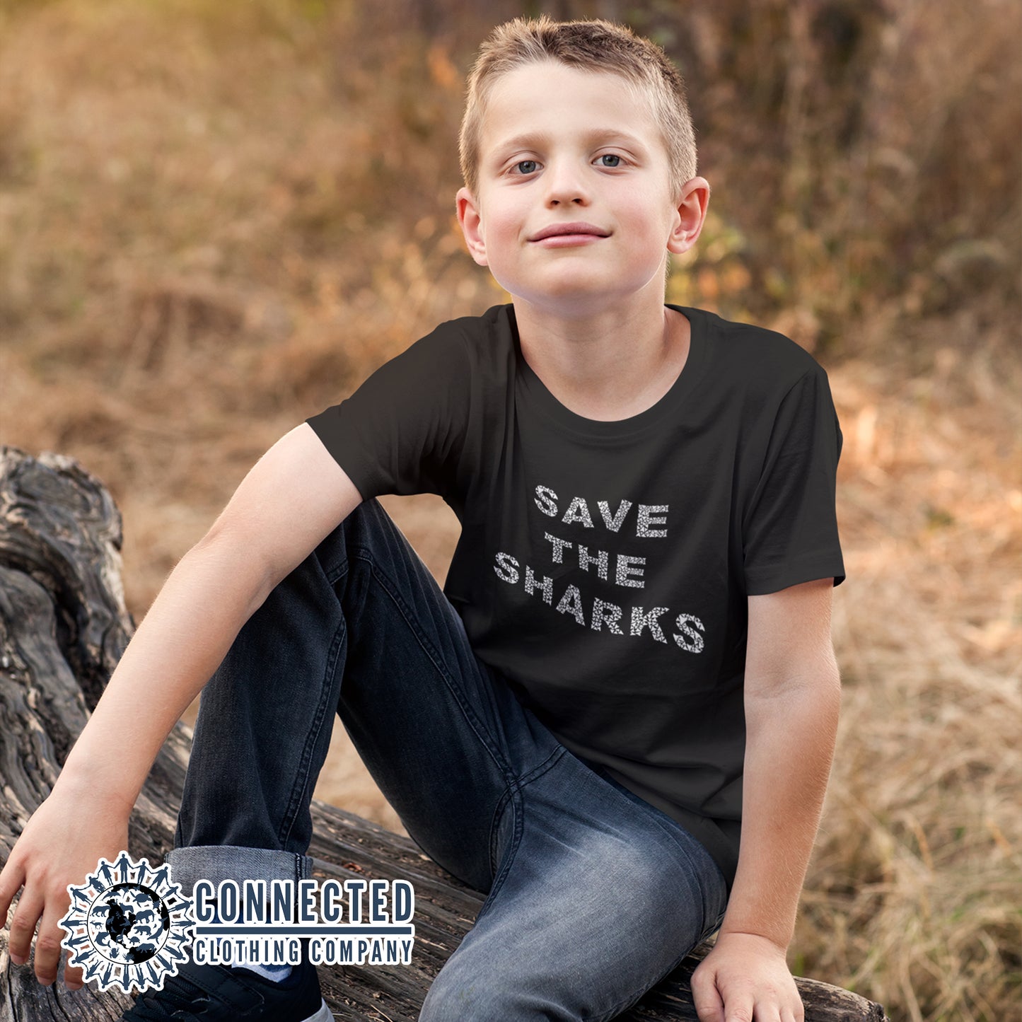 Boy Model Wearing Black Save The Sharks Youth Short-Sleeve Tee - Connected Clothing Company - 10% of profits donated to Oceana shark conservation