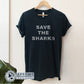 Black Save The Sharks Short-Sleeve Unisex T-Shirt reads "Save The Sharks." - Connected Clothing Company - Ethically and Sustainably Made - 10% donated to Oceana shark conservation