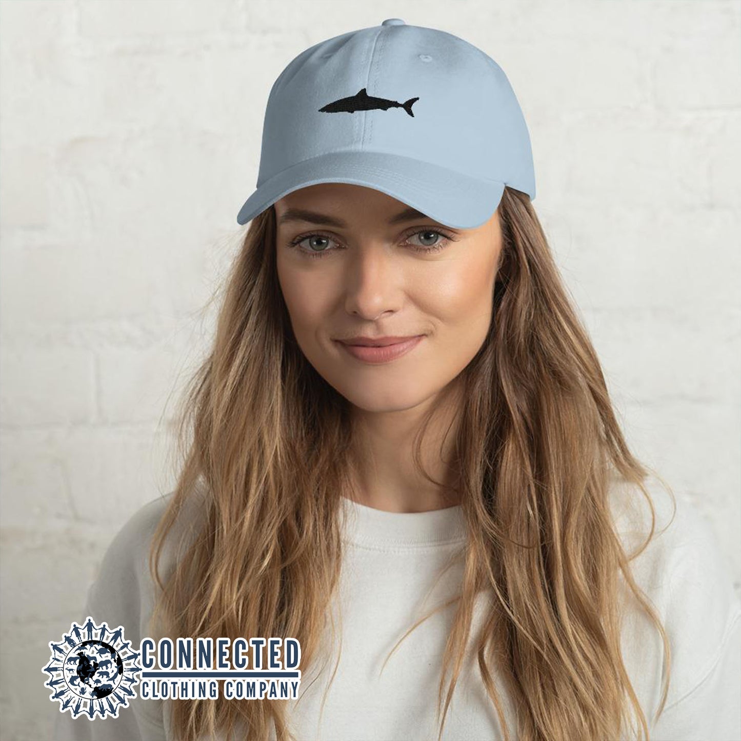 Model Wearing Blue Shark Cotton Cap - Connected Clothing Company - Ethical & Sustainable Clothing That Gives Back - 10% donated to Oceana shark conservation
