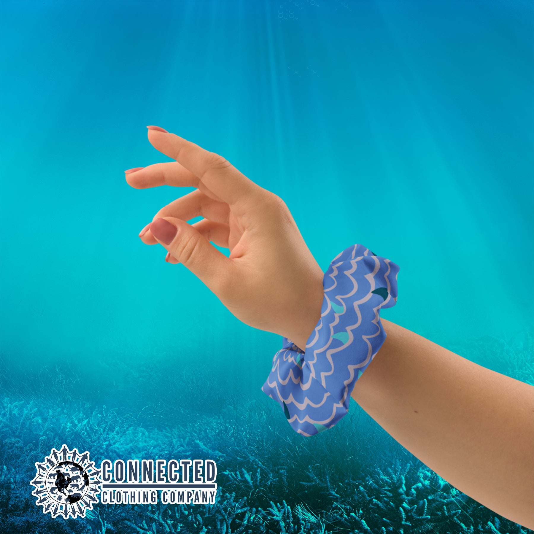 Shark Fin Scrunchie in Blue Color on Wrist - Connected Clothing Company - Ethical & Sustainable Apparel - 10% donated to save the sharks