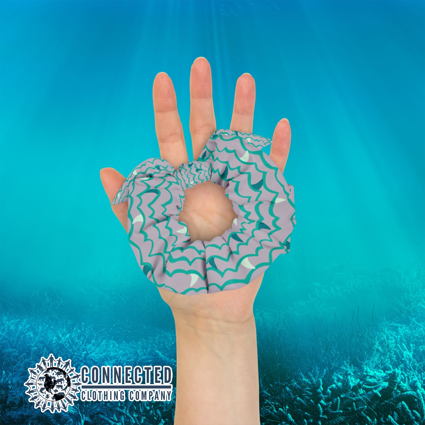 Hand Holding Shark Fin Scrunchie in Green Color - Connected Clothing Company - Ethical & Sustainable Apparel - 10% donated to save the sharks