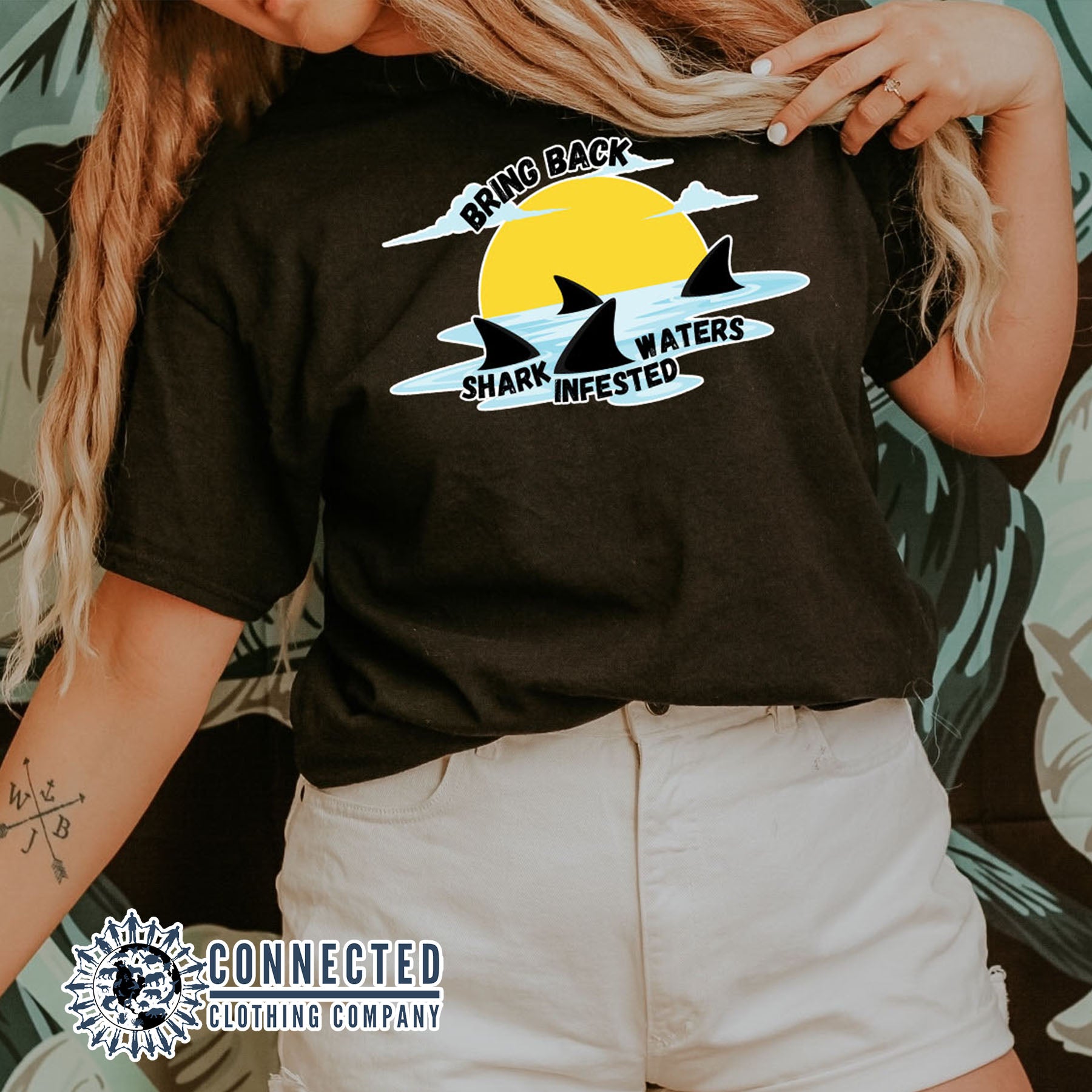 Model Wearing Black Bring Back Shark Infested Waters Unisex Short-Sleeve Tee - Connected Clothing Company - Ethically and Sustainably Made - 10% of profits donated to shark conservation and ocean conservation