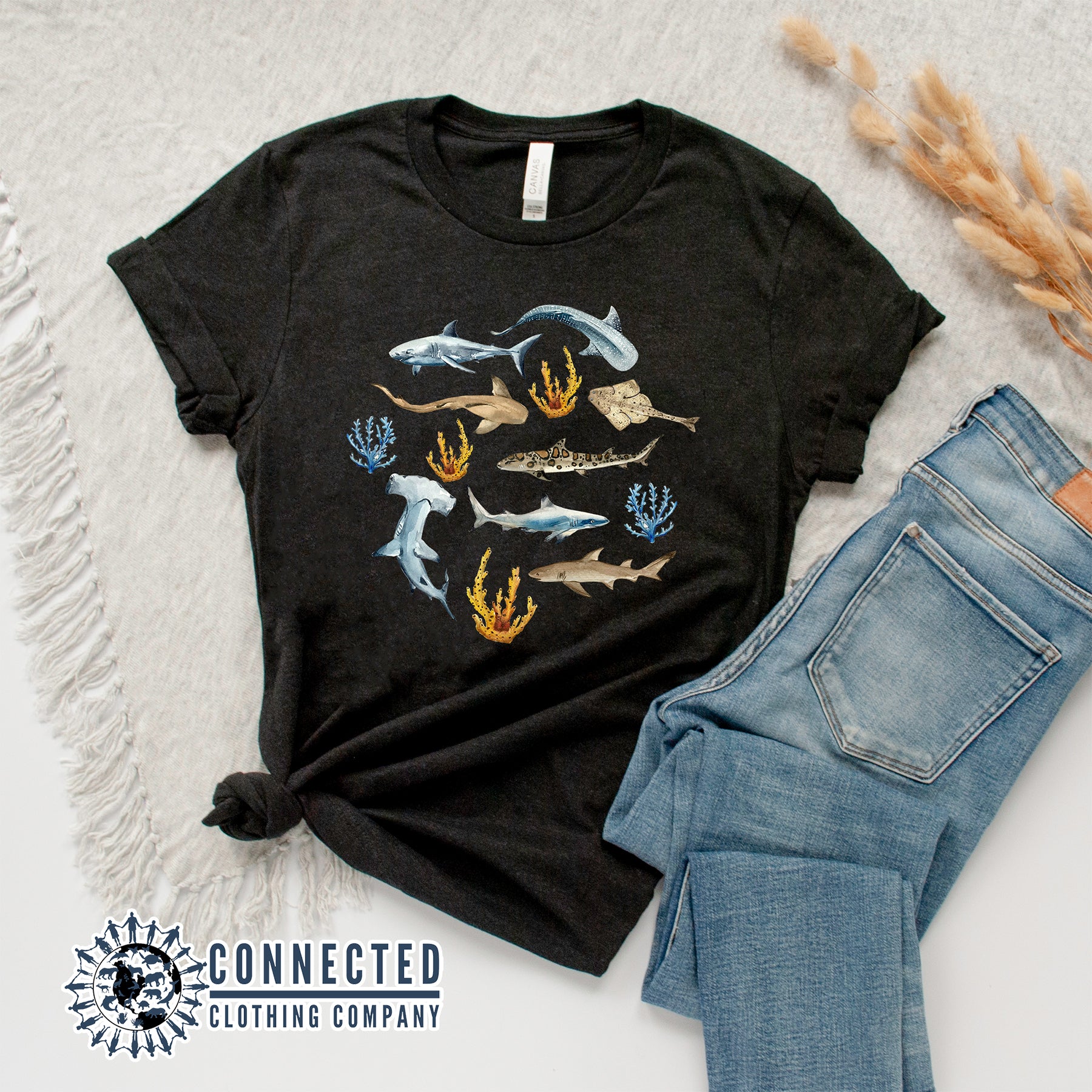 Flatlay of Black Shark Ocean Watercolor Unisex Short-Sleeve Tshirt - Connected Clothing Company - Ethically and Sustainably Made - 10% of profits donated to shark conservation and ocean conservation