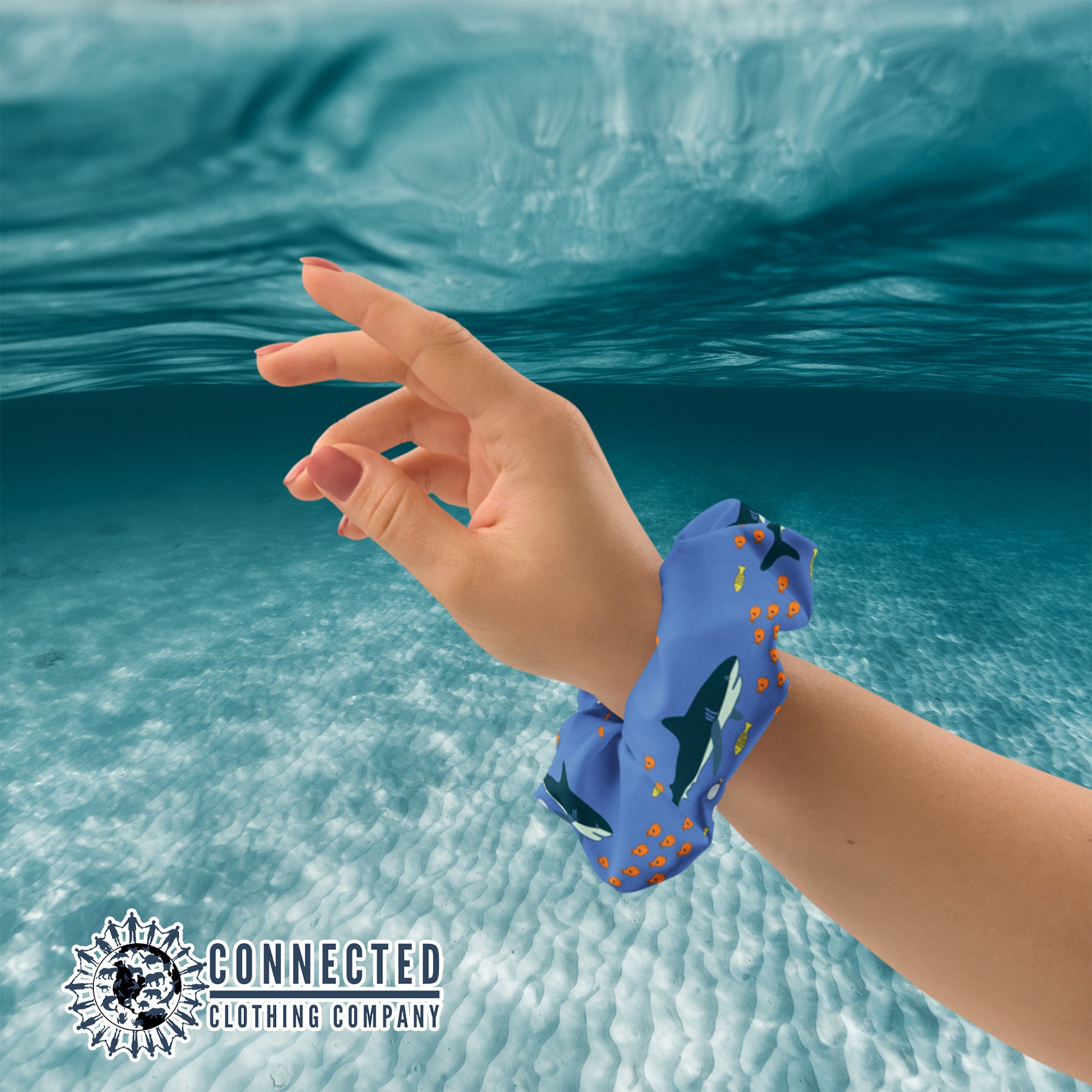 Wrist Holding Shark Scrunchie in Dark Color - Connected Clothing Company - Ethical & Sustainable Apparel - 10% donated to save the sharks