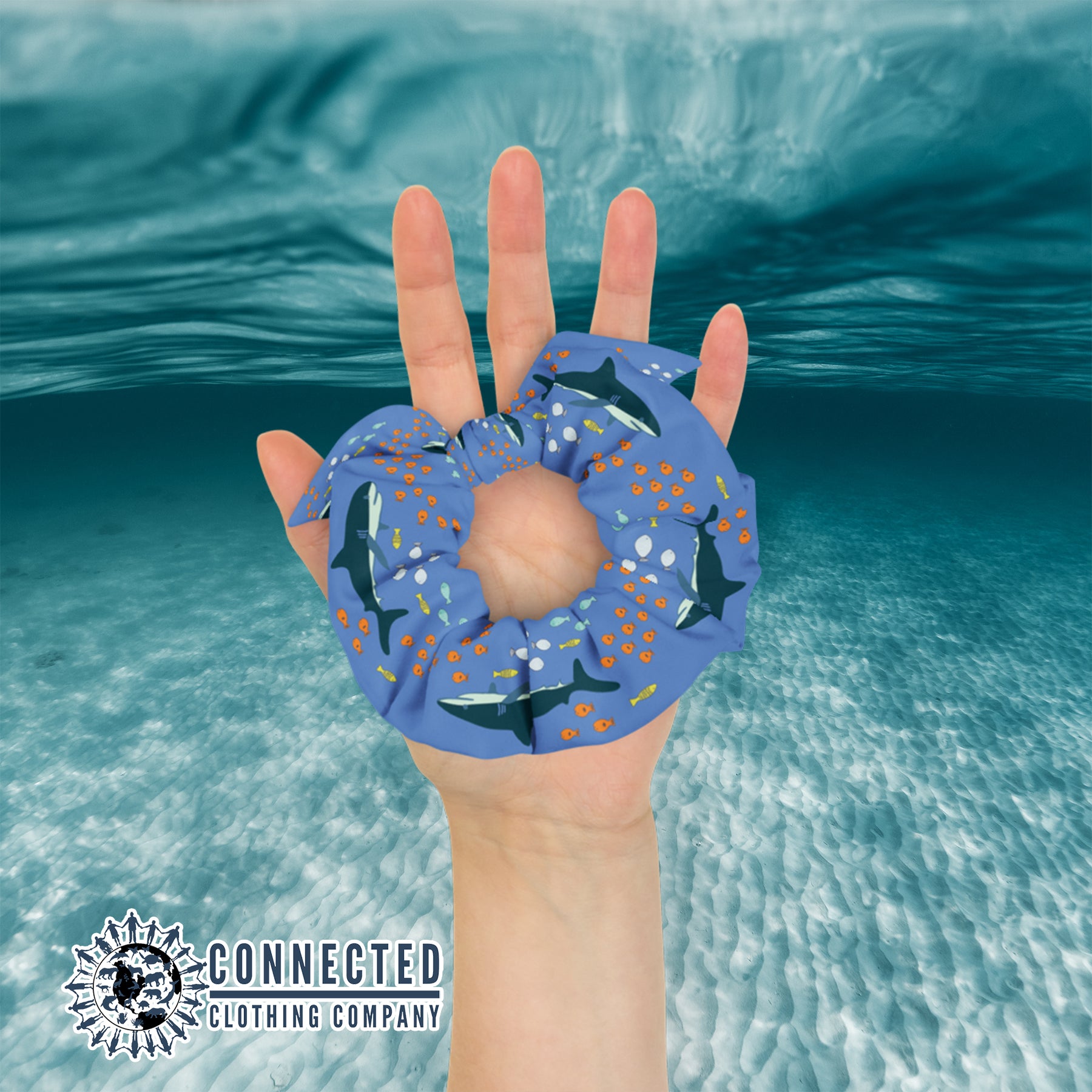 Hand Holding Shark Scrunchie in Dark Color - Connected Clothing Company - Ethical & Sustainable Apparel - 10% donated to save the sharks