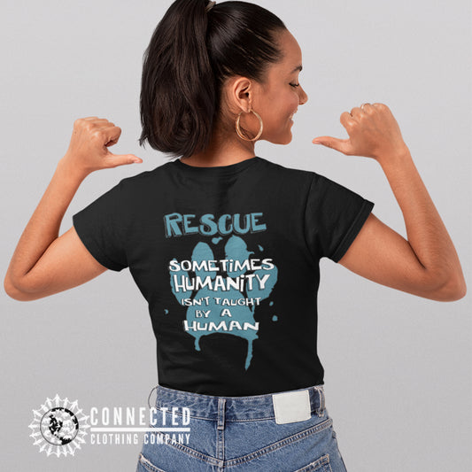 Model Wearing Black Show Humanity Short-Sleeve Tee reads "Rescue. Sometimes humanity isn't taught by a human" - Connected Clothing Company - Ethically and Sustainably Made - 10% donated to animal rescue