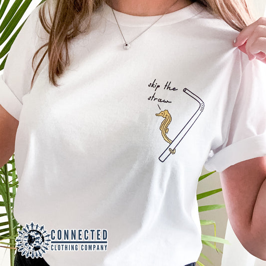 Model Wearing White Skip The Straw Seahorse Tee (Seahorse holding onto straw while saying skip the straw) - Connected Clothing Company - Ethically and Sustainably Made - 10% donated to Mission Blue ocean conservation