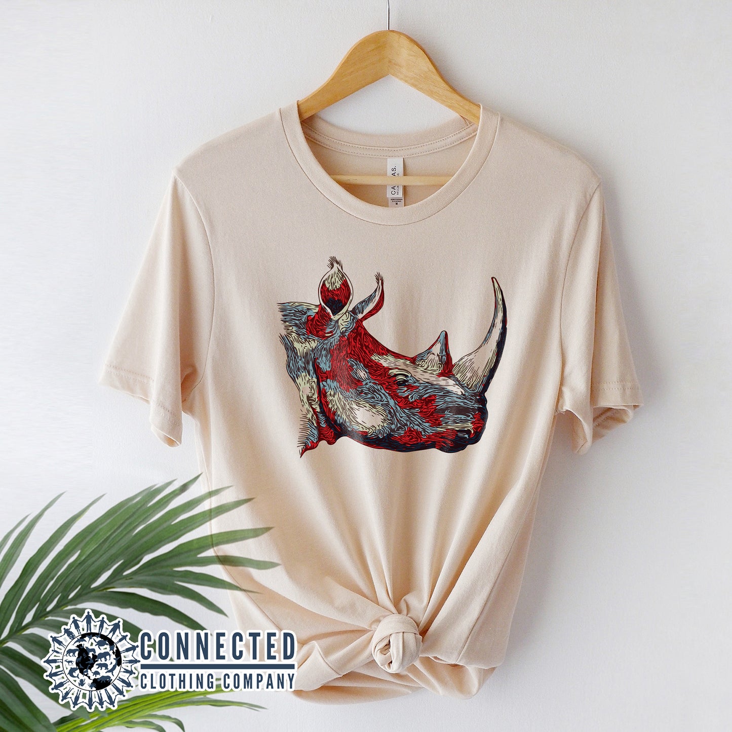 Hanger With Soft Cream Vanishing Into Extinction Rhino Tshirt - Connected Clothing Company - Ethically and Sustainable Clothing - 10% of proceeds are donated to rhino conservation