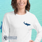Model Wearing White Embroidered Whale Shark Long-Sleeve Shirt - Connected Clothing Company - Ethically and Sustainably Made - 10% of profits donated to shark conservation and ocean conservation